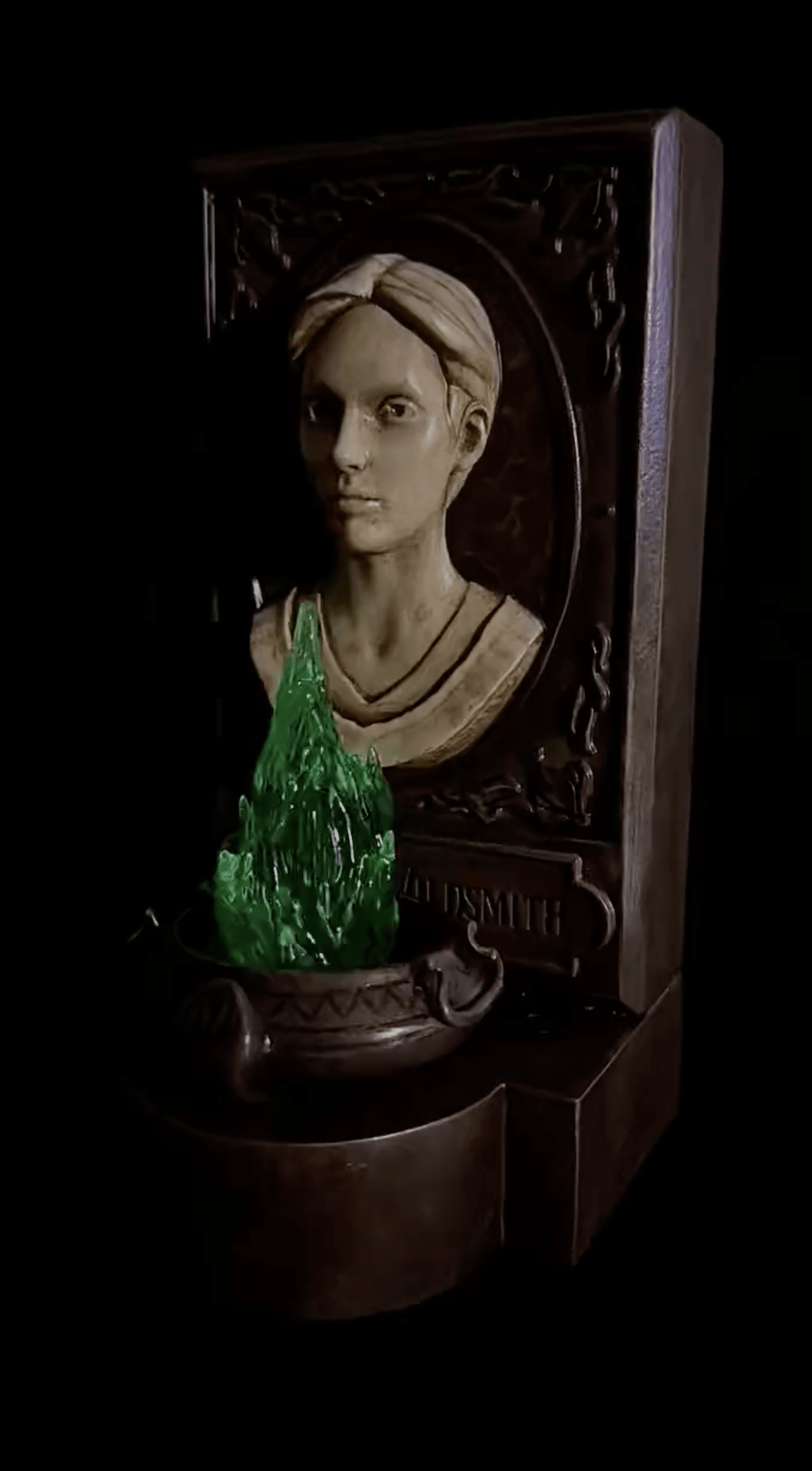 Fan art of female bust with green emerald flame sculpture in front